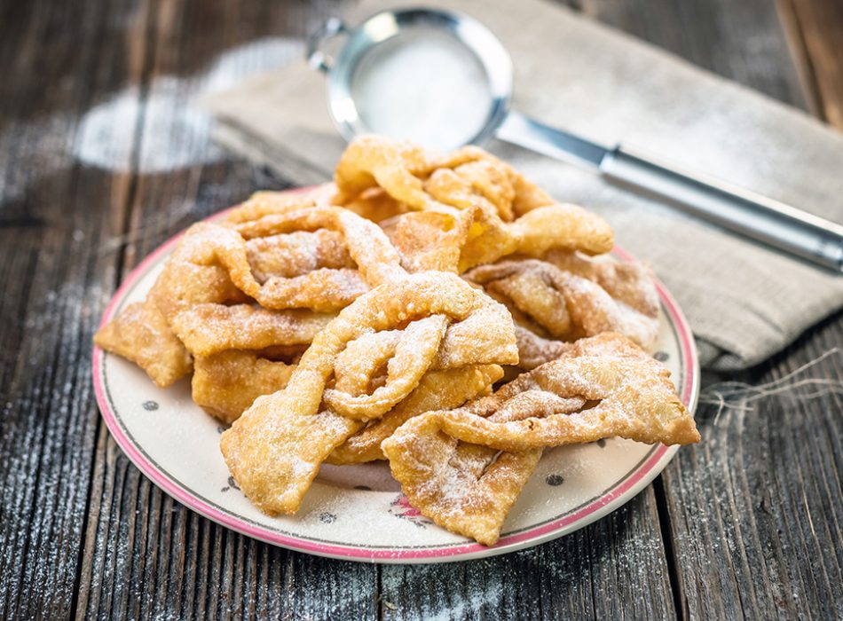 Flancat- crisp deep fried pastry dusted with powdered sugar